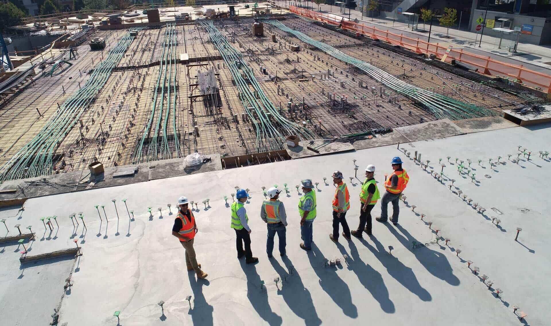 Crew working across a large roof deck