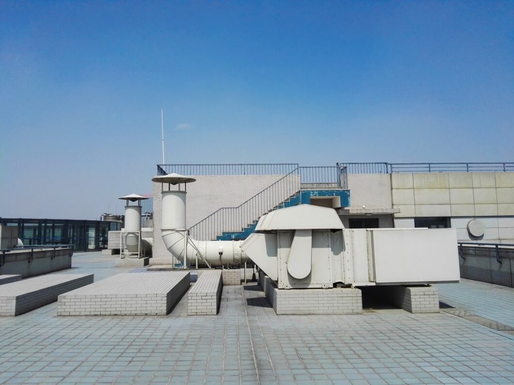 Commercial roof leak repair around rooftop equipment